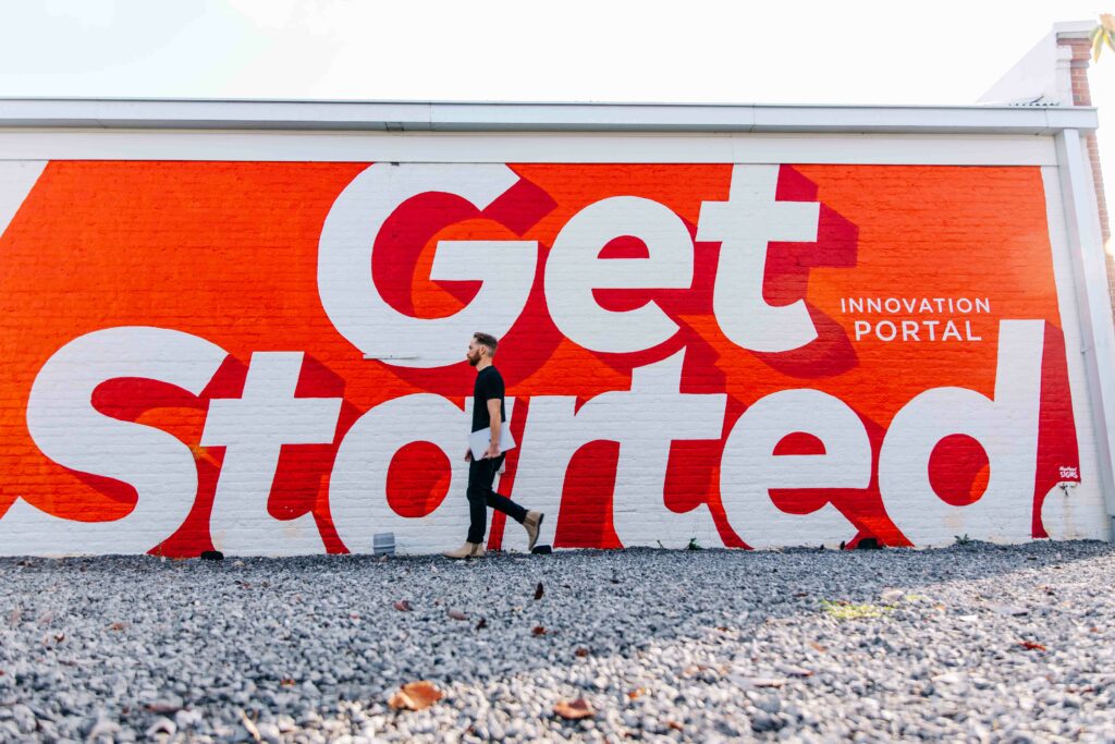 External mural that reads "Get Started."